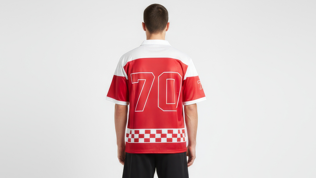 Person wearing a red and white sports jersey with the number 70 on a plain background