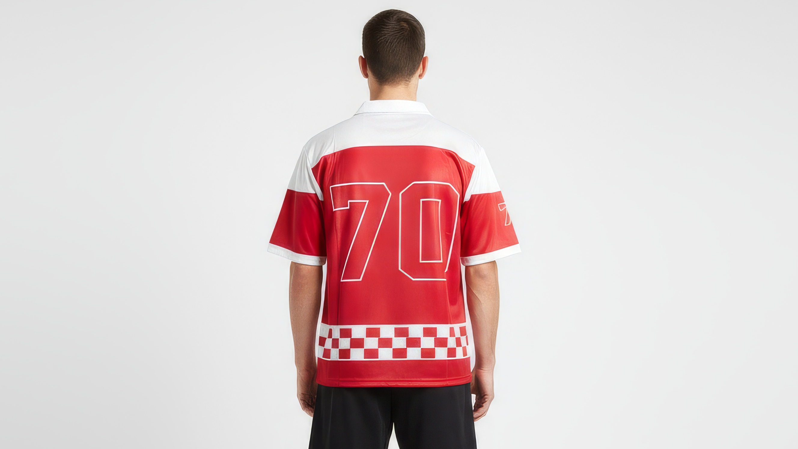 Person wearing a red and white sports jersey with the number 70 on a plain background